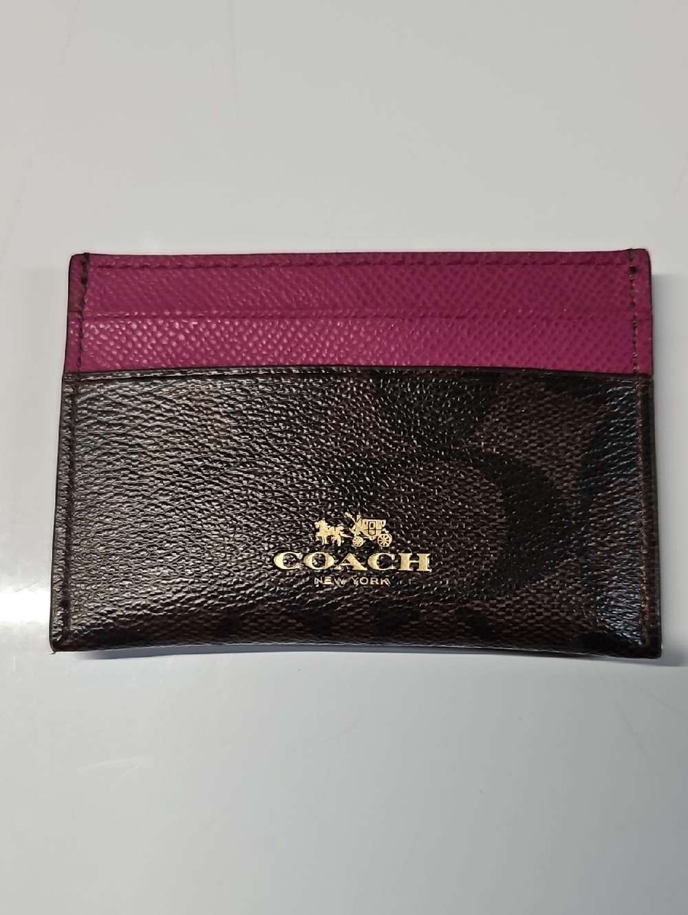 COACH, PINK AND BROWN CARD HOLDER. 4" X 2 3/4"